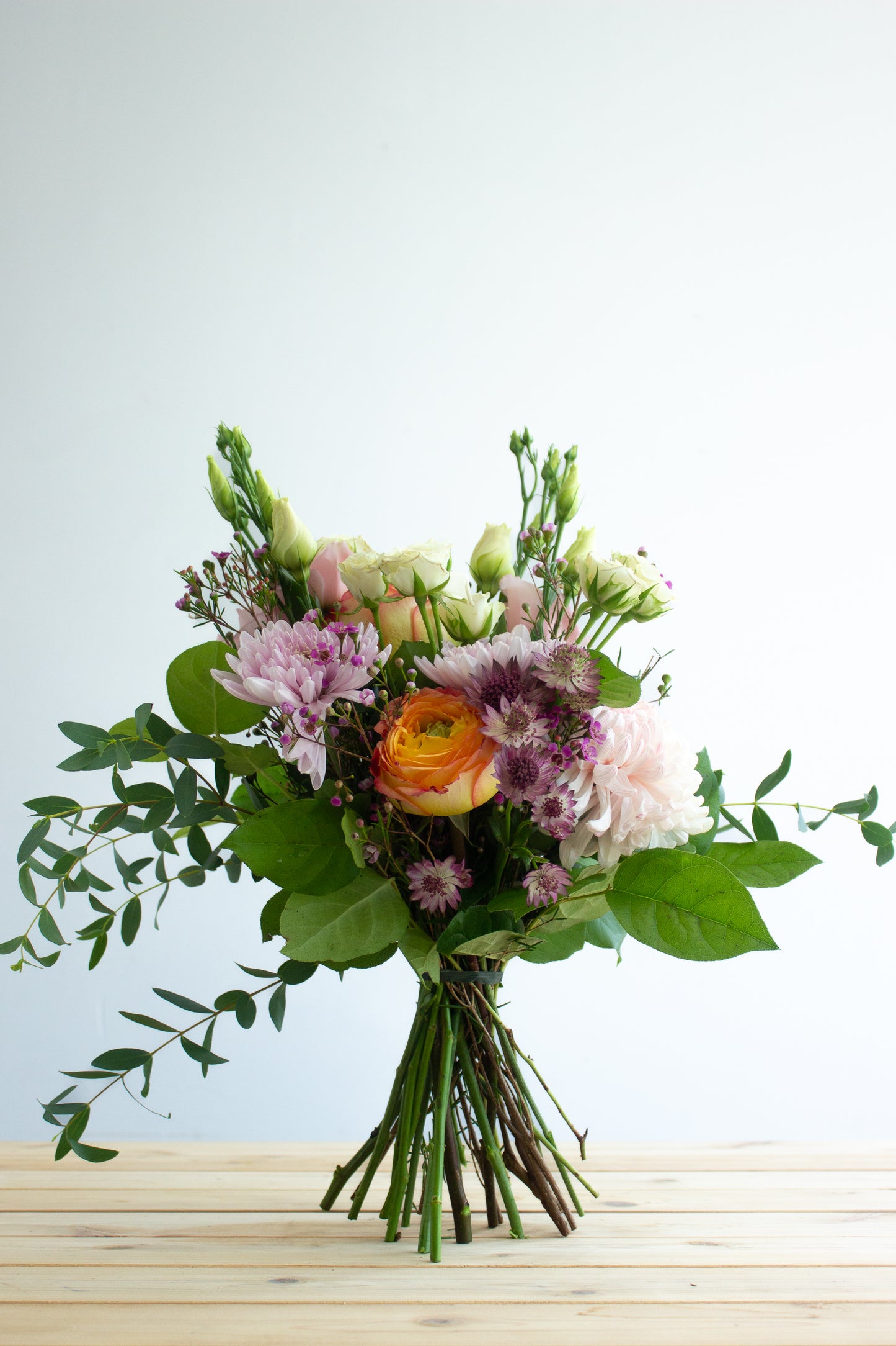 White, purple, and green floral bouquet. Photography by Vibeke Silverthorne, 2023